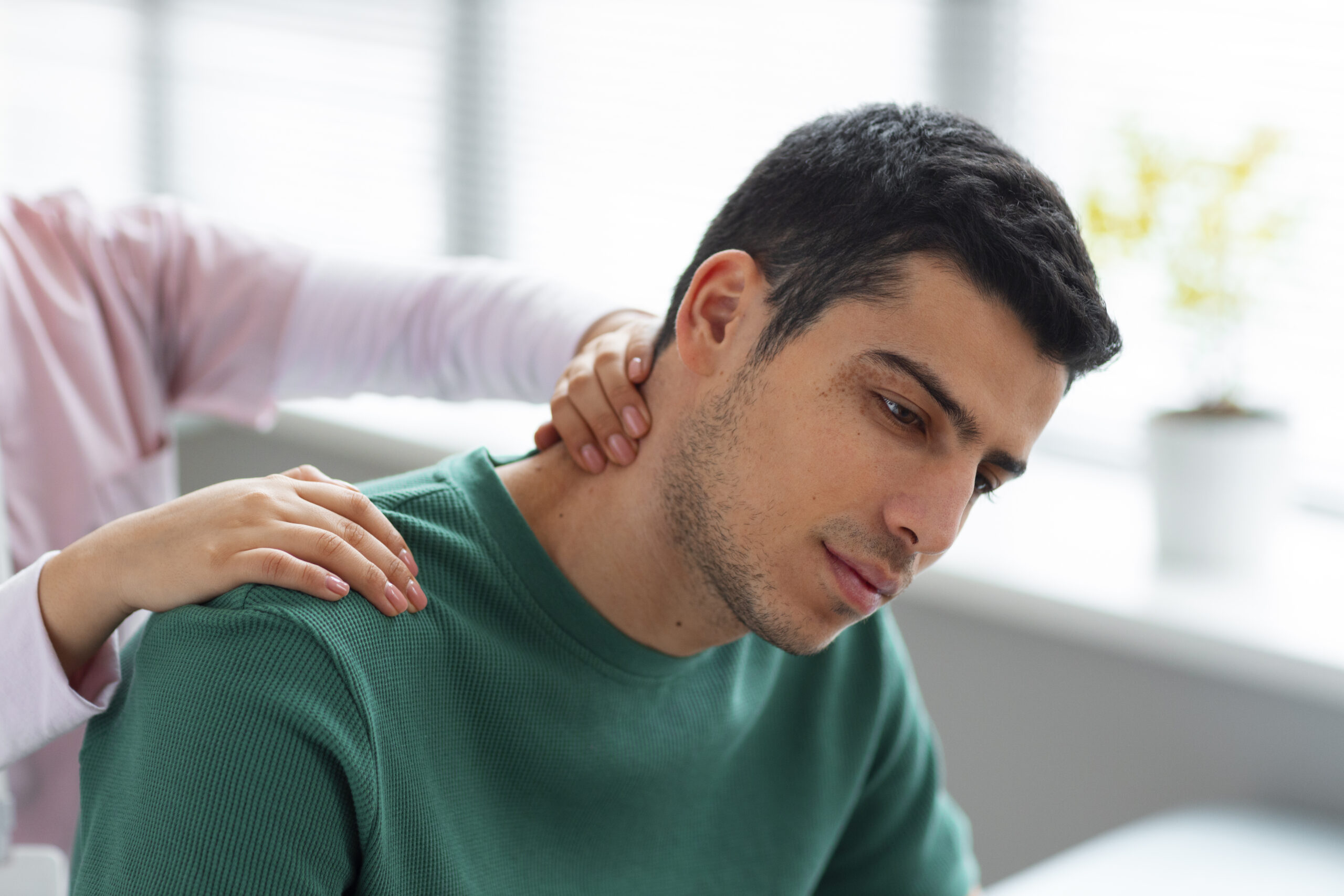 Doctor guiding a patient through rehabilitation after an auto accident