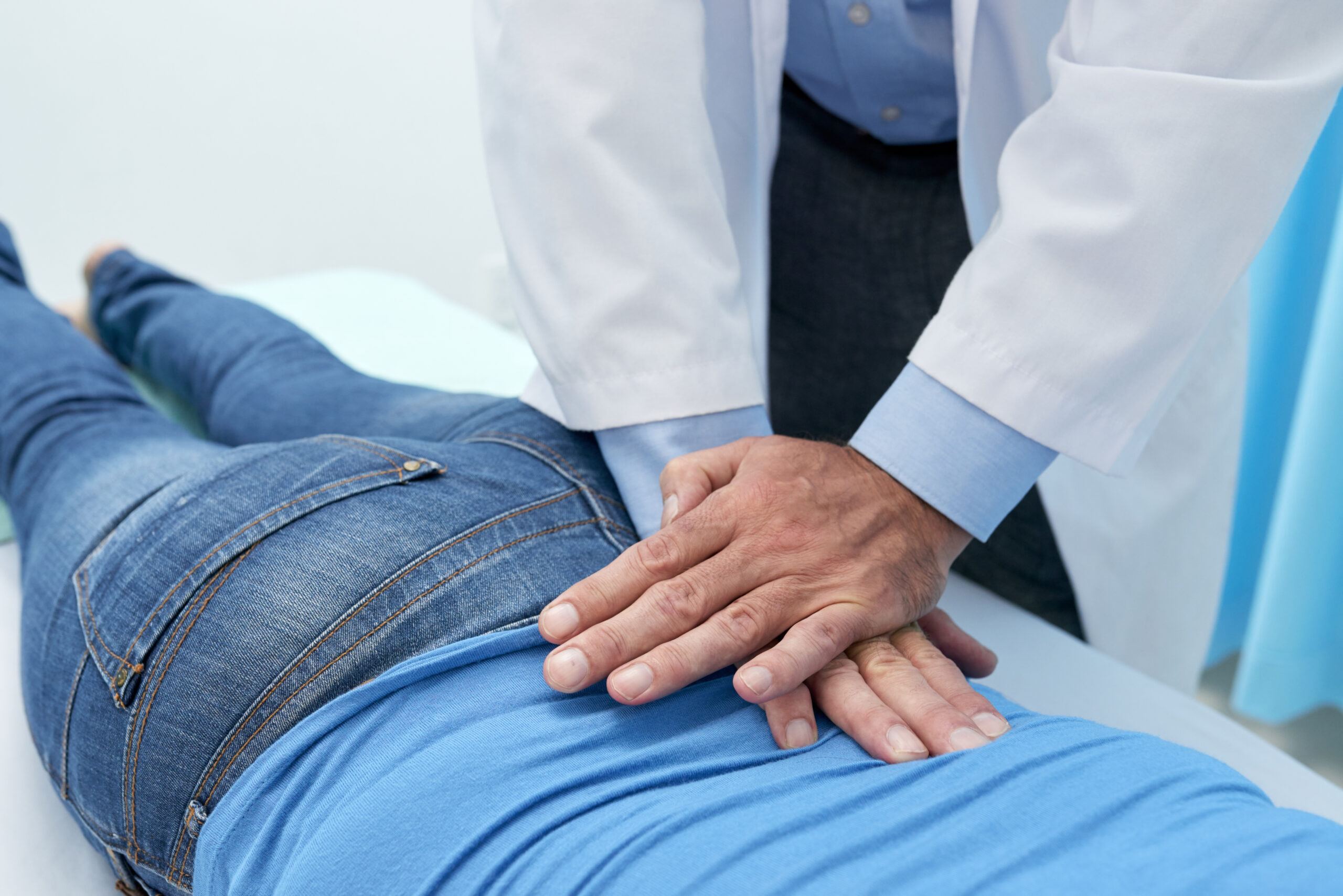 Chiropractor performing a spinal adjustment on a patient in DeLand, FL