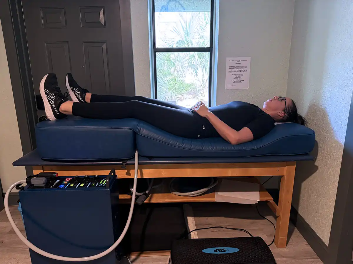 Patient receiving PEMF therapy on the Blue Mat at Chiropractic Connection Center